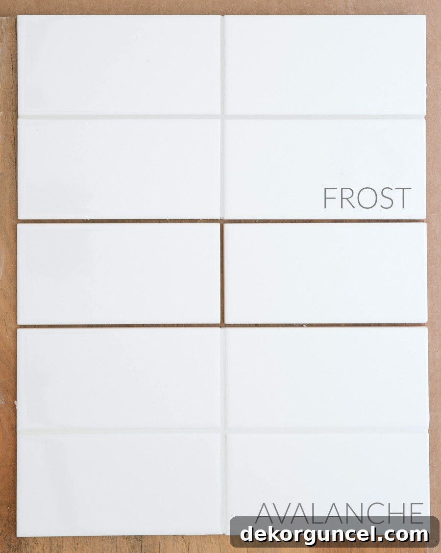 White Subway Tile and Gray Grout My Favorite Shades 8 Comparison of Mapei Frost (light gray) and Avalanche (soft white) grout on white subway tiles after drying, showing distinct color differences.