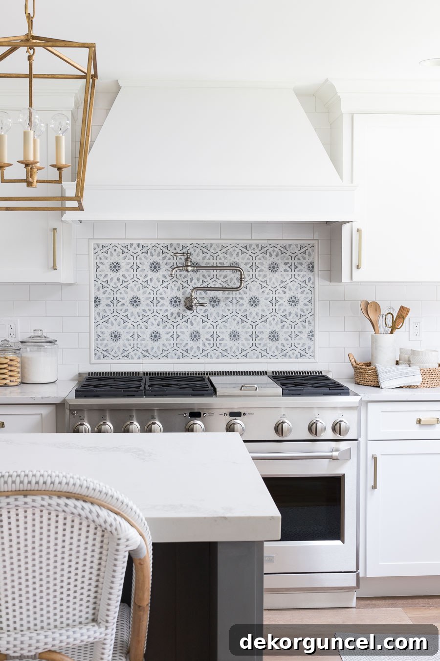 Our Kitchen Remodel: From Drab to Dreamy 17 Captivated by the exquisite mosaic tile accent behind the range and the elegant pot filler. All product sources for this stunning kitchen design are detailed within the post.