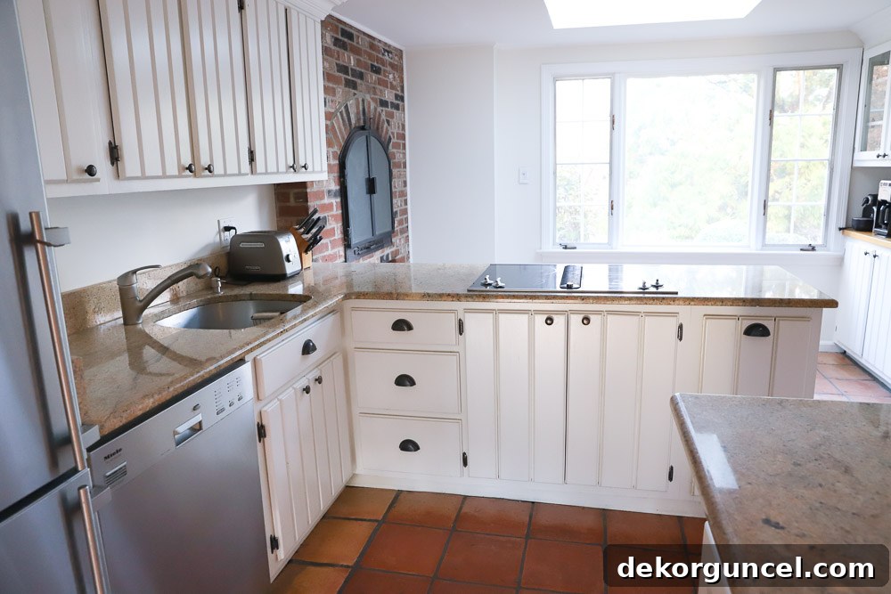 Our Kitchen Remodel: From Drab to Dreamy 19 The original area by our kitchen window, featuring the fireplace before our extensive kitchen renovation, showcasing the spatial challenges.