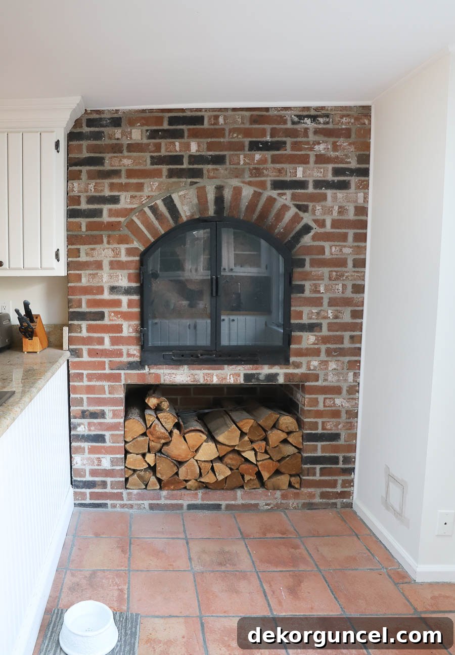 Our Kitchen Remodel: From Drab to Dreamy 21 A captivating image of the original brick fireplace in our kitchen, prior to its removal for the space-optimizing renovation.