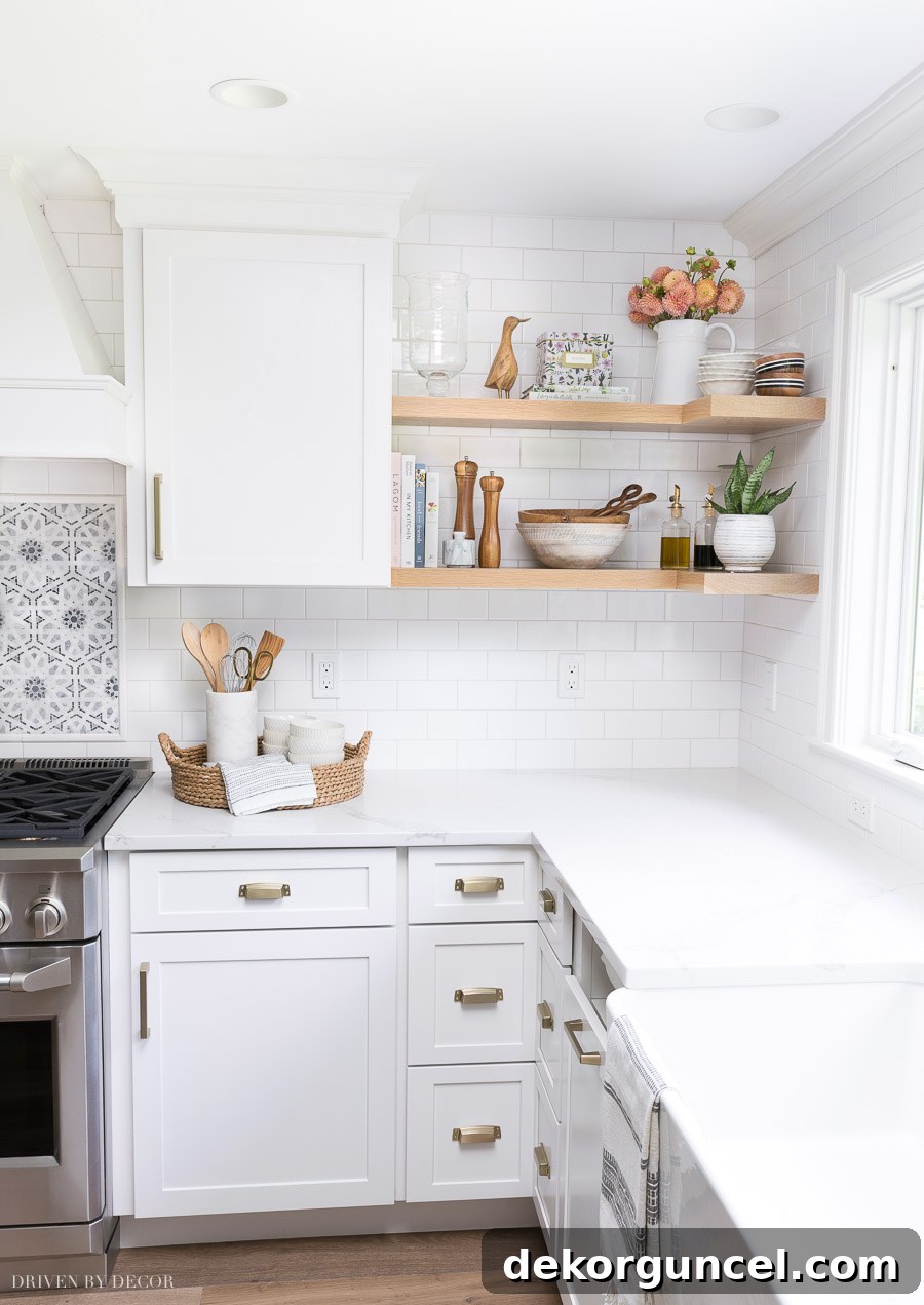 Our Kitchen Remodel: From Drab to Dreamy 22 Highlighting the elegant open wood shelving that wraps seamlessly around the corner, a key and beloved detail of this comprehensive kitchen remodel, adding both style and storage.