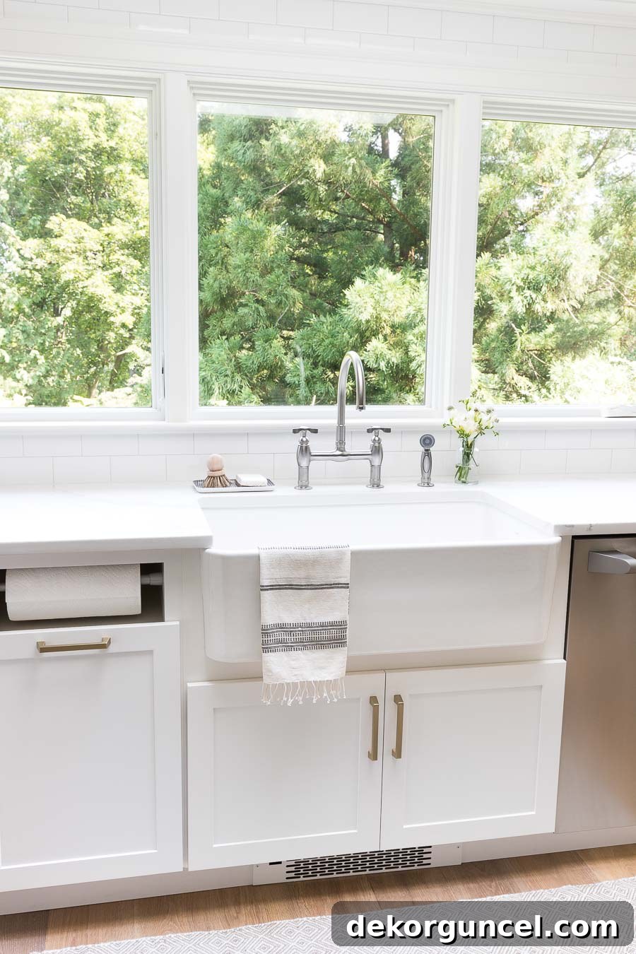 Our Kitchen Remodel: From Drab to Dreamy 25 Our newly installed gorgeous bridge faucet and spacious farmhouse sink, offering a beautiful view. All product sources linked within the post.
