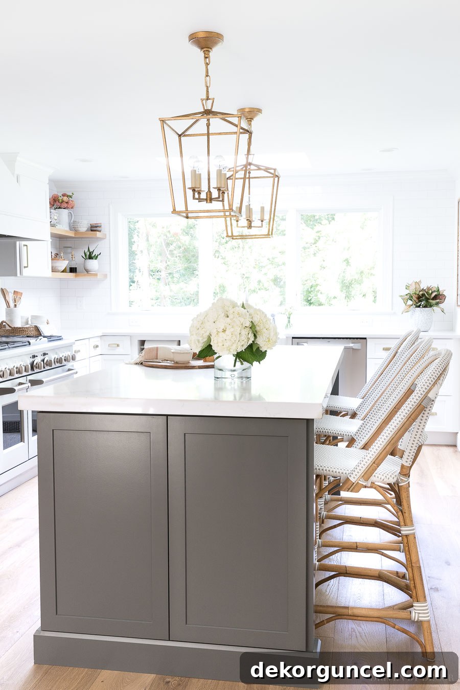 Our Kitchen Remodel: From Drab to Dreamy 34 Experience the stunning contrast of our long, dark gray kitchen island paired with comfortable counter-height rattan seating, creating a stylish and inviting space.