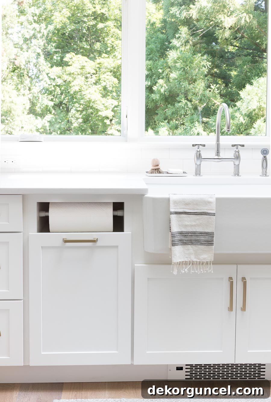 Our Kitchen Remodel: From Drab to Dreamy 9 Discover our favorite built-in paper towel holder, seamlessly integrated into the kitchen cabinetry to keep countertops clear and organized.