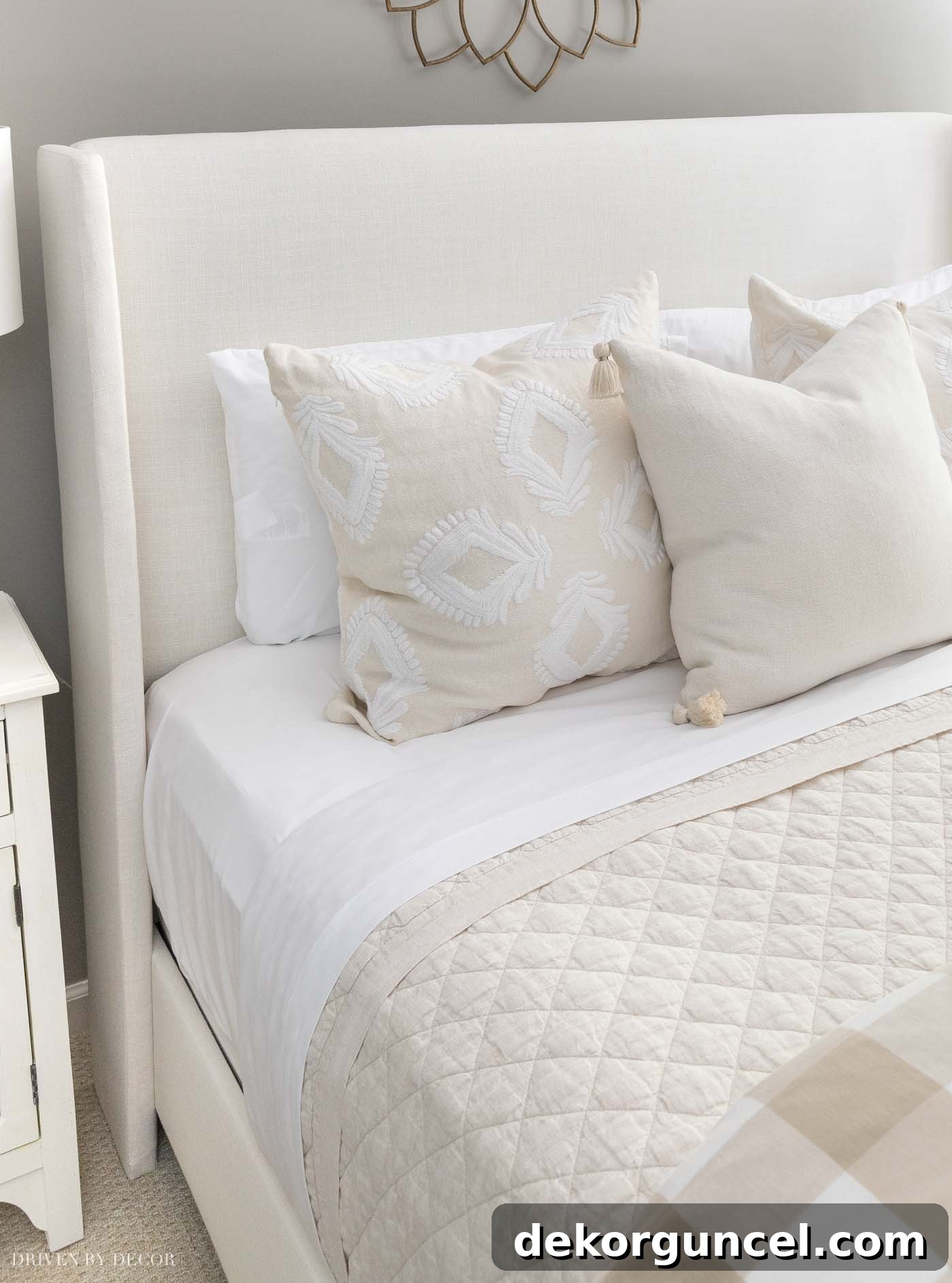 Guest room bedding featuring a beautiful Belgian Flax Linen Diamond quilt in white, layered for comfort and style. Includes tips for making the perfect bed.