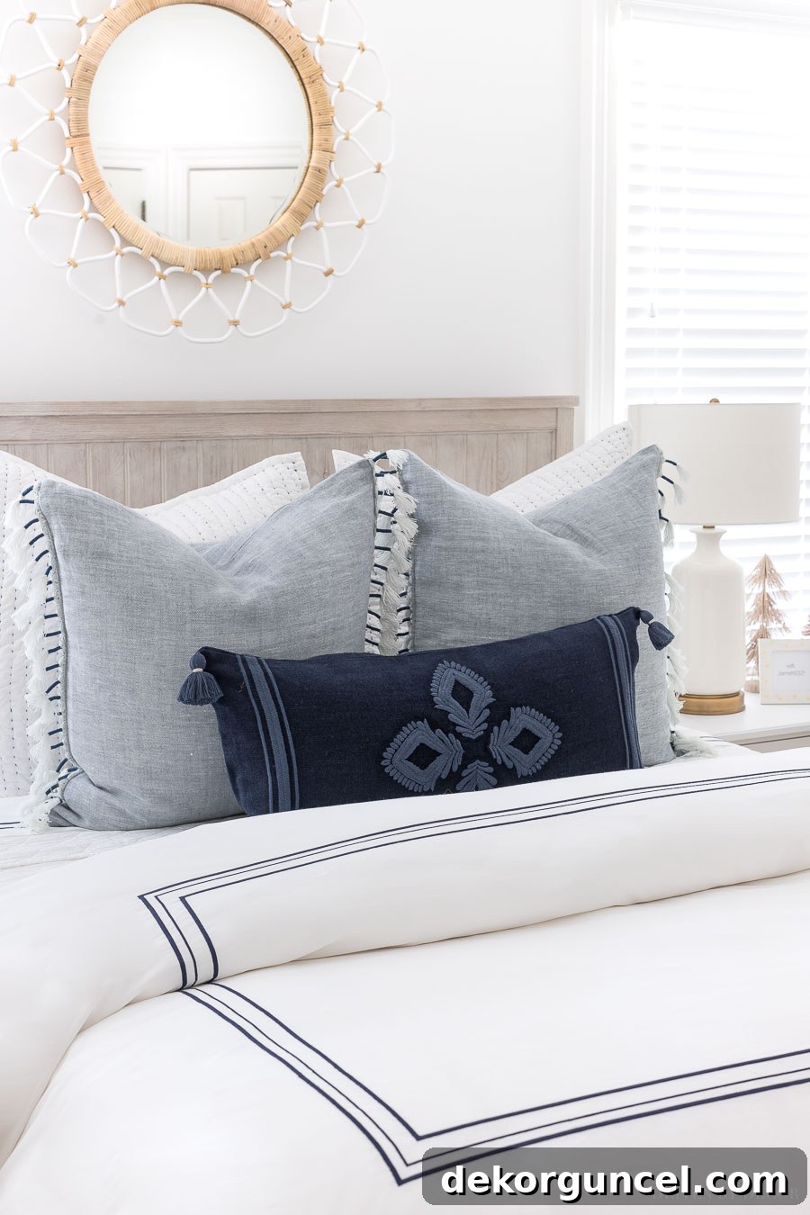 Gorgeous blue and white pillows arranged perfectly on a guest bed, balancing aesthetic appeal with practical guest comfort.