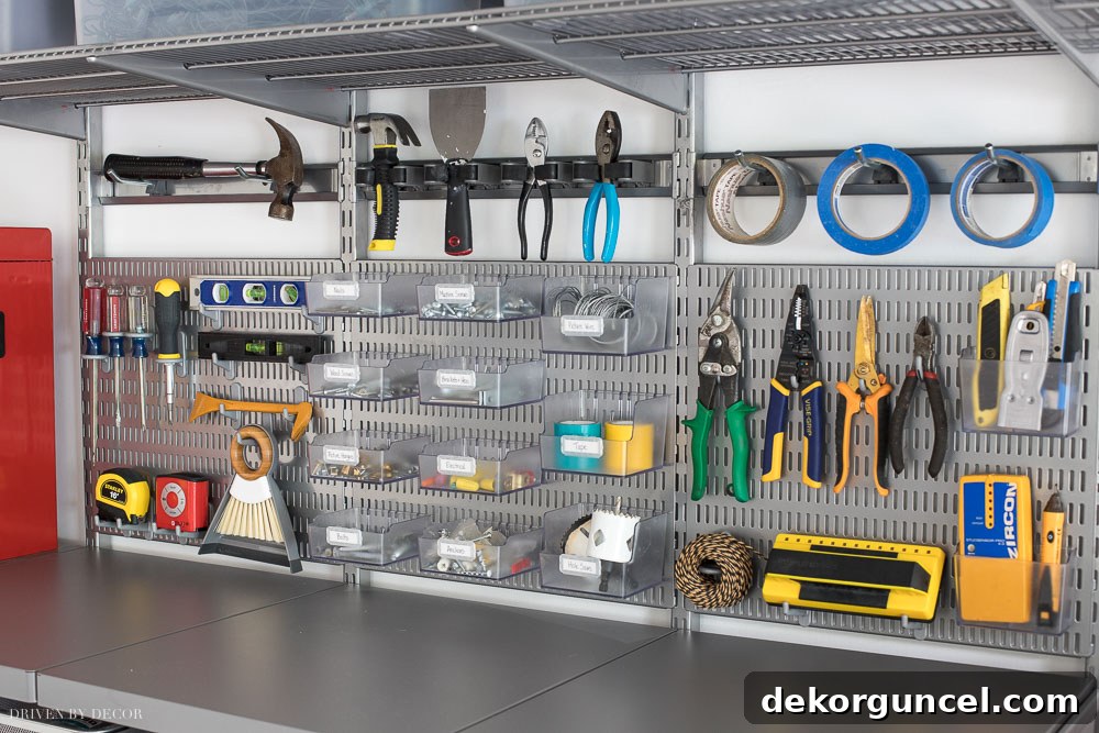These Elfa utility boards are exceptional, offering an excellent method for organizing all frequently used tools and hardware in your garage.