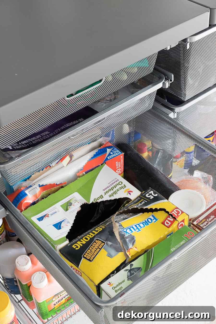 Admiring the diverse storage options provided by these Elfa mesh drawers, integral to an exceptional garage organization system.