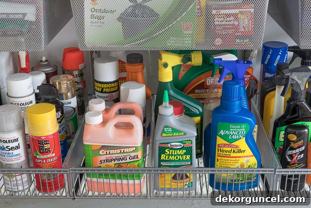 Elfa shelf baskets neatly organize all bottles and spray cans in this newly organized garage.