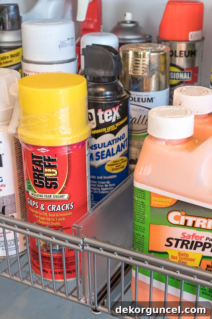 Elfa clear basket dividers simplify grouping products on the shelves of this garage organizer.