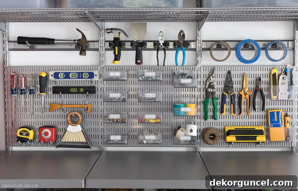 Showcasing how I organized my frequently used hardware and tools in our garage, highlighting the effectiveness of Elfa's utility boards, hooks, and bins.