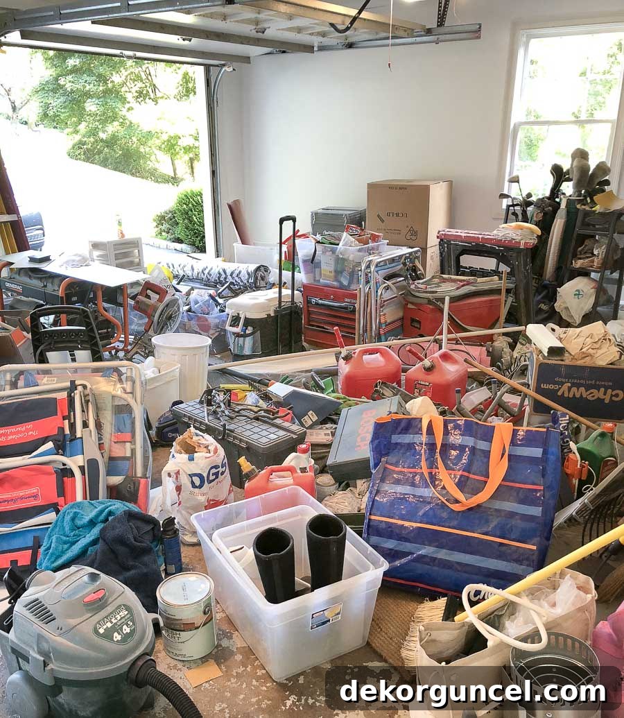 Progress photos of our garage clean-out, showing the initial messy stage before organization.
