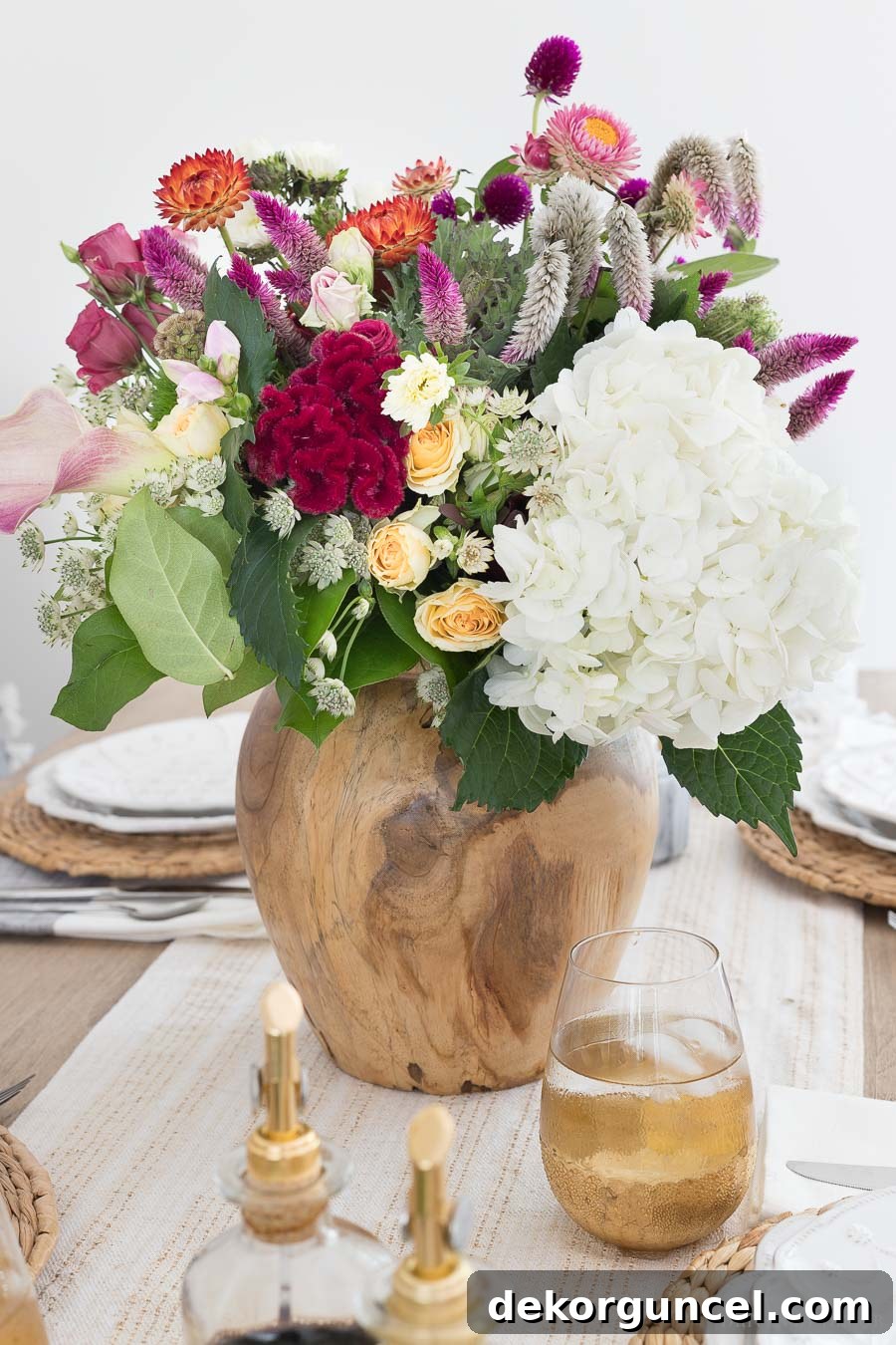 A beautiful round acacia wood vase, perfect for displaying flowers and adding a natural element to any tablescape. The source is linked in the post.
