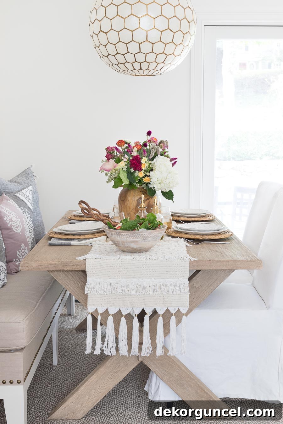 The perfect wood trestle dining table, featuring a beautiful grain and a sturdy design, ideal for a modern kitchen and complementing the overall aesthetic of the renovated space.