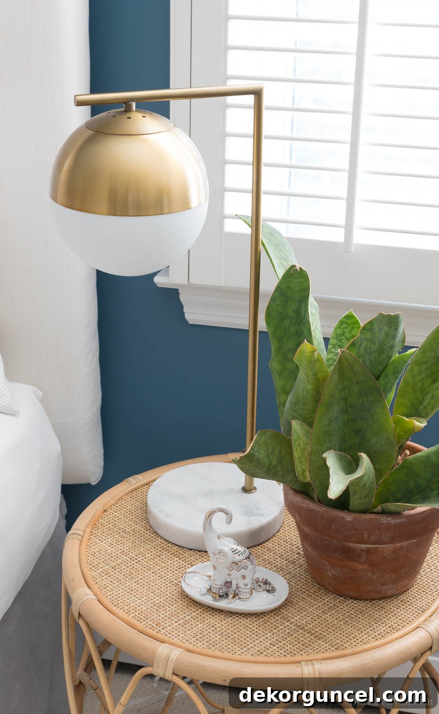 Behind the Illumination: My Home's Fixture Selections 22 A stylish brass globe lamp with a marble base, offering a modern aesthetic at a great price, perfect for a contemporary bedroom.