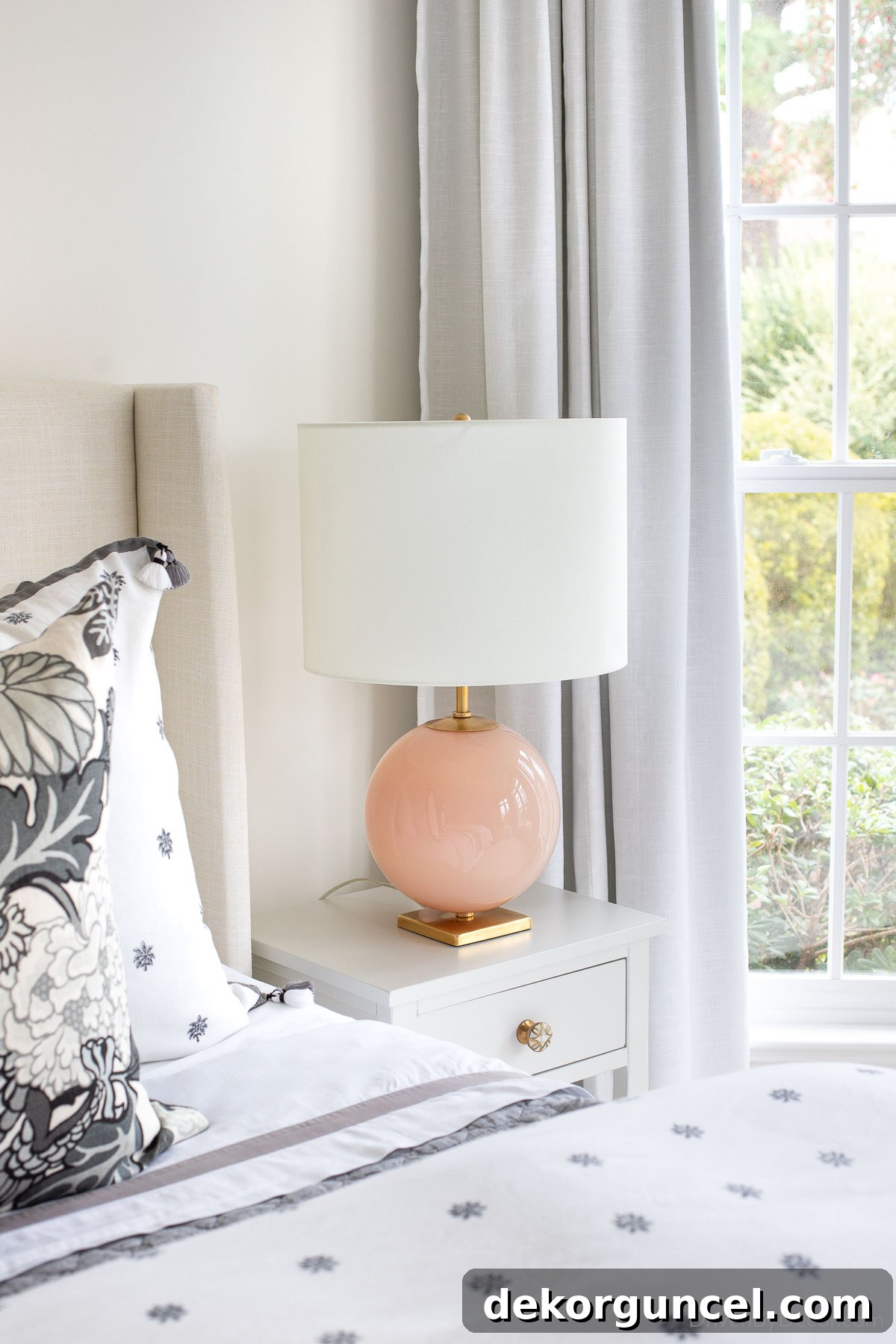 Behind the Illumination: My Home's Fixture Selections 23 Bedroom lamps featuring a round blush base on stylish nightstands, adding a soft pop of color and elegance.