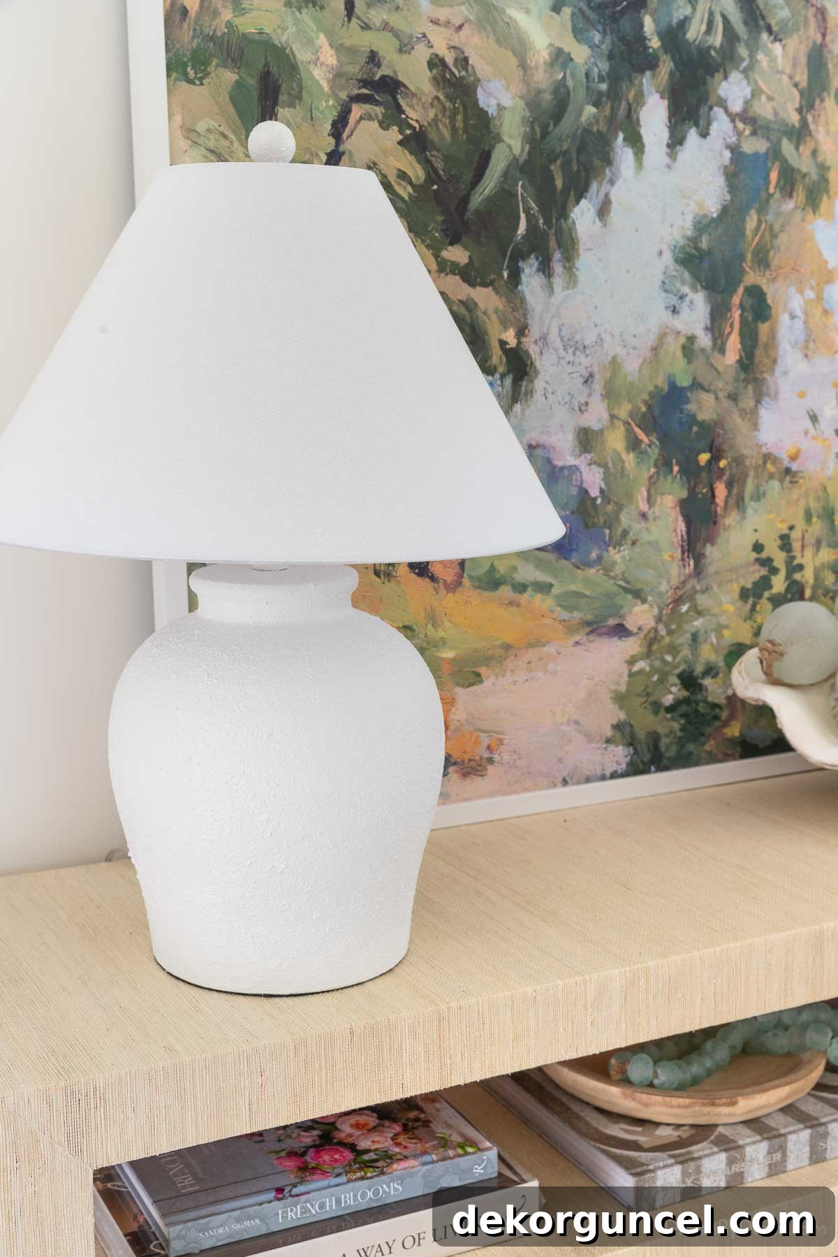 Behind the Illumination: My Home's Fixture Selections 28 A striking white lamp with a modern tapered shade, perfectly placed on an entryway console table.