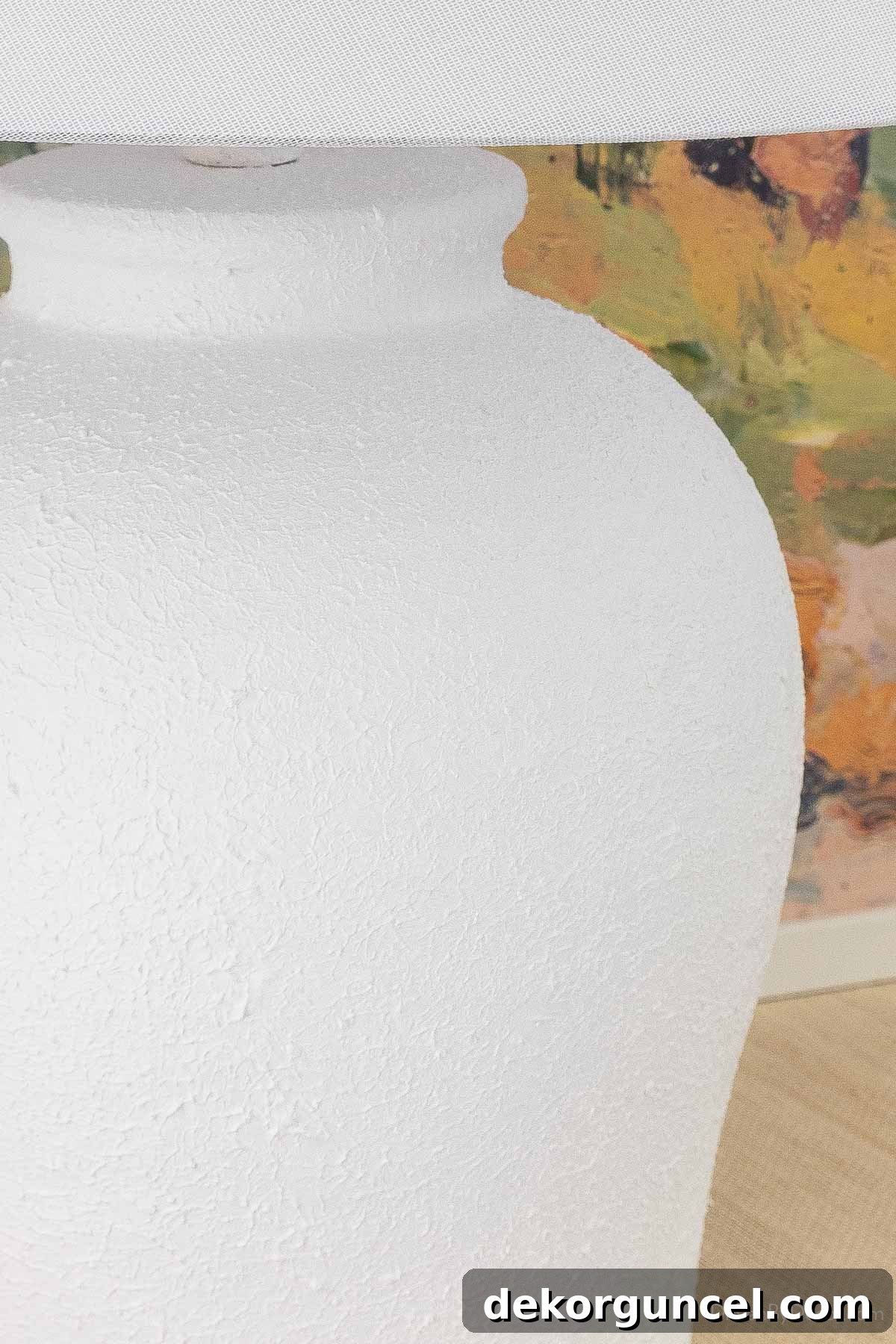Behind the Illumination: My Home's Fixture Selections 29 Close-up of an entryway console table with a white textured lamp, highlighting its design and how it complements the colorful art.