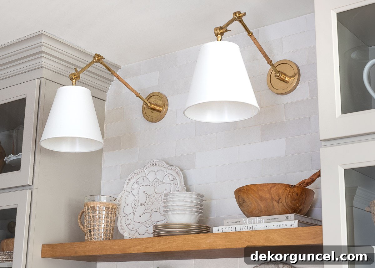 Behind the Illumination: My Home's Fixture Selections 36 Elegant brass swing arm sconces placed over our kitchen coffee bar, adding a touch of sophistication and warm lighting.
