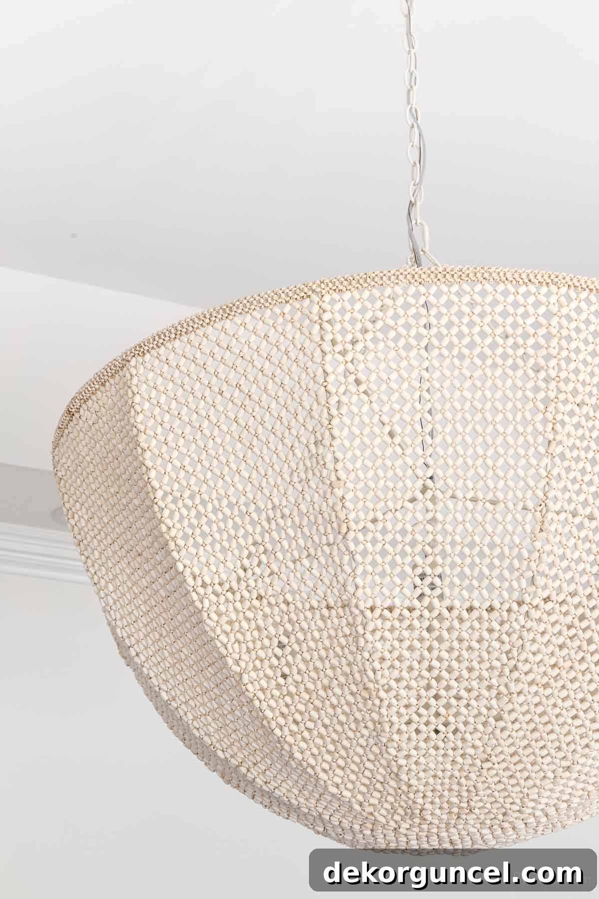 Behind the Illumination: My Home's Fixture Selections 8 A detailed close-up view of the intricate beadwork design on the chandelier, showcasing its exquisite craftsmanship.