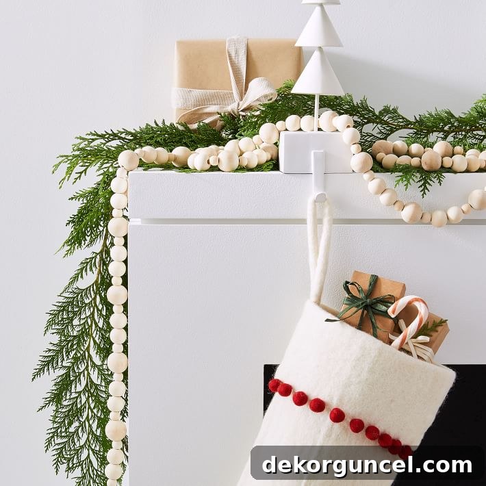 Gorgeous wood bead garland for Christmas! Looks beautiful intertwined with greenery on a mantel! A versatile garland, perfect for adding rustic charm and texture to holiday displays.