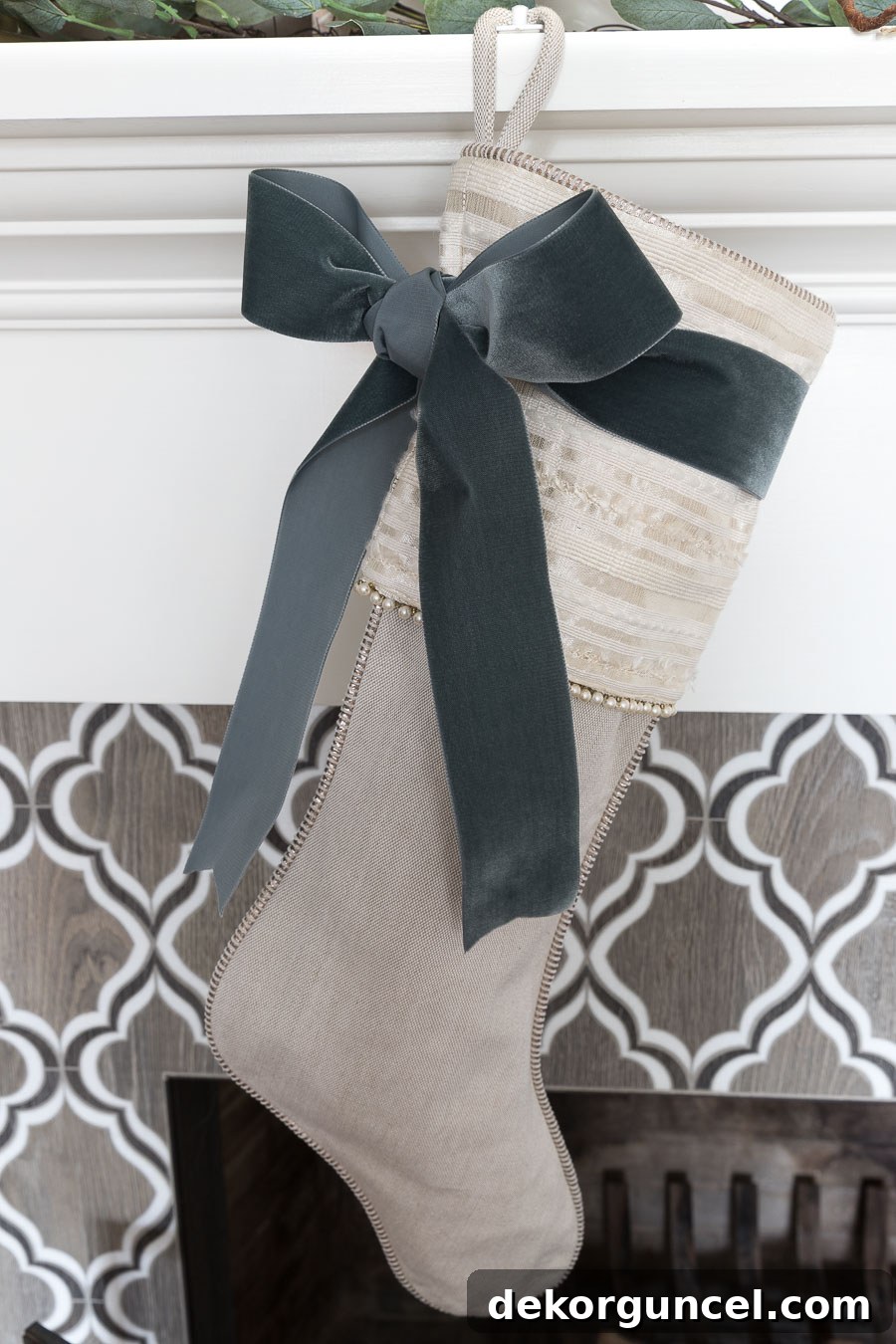 Elegant dark gray velvet ribbon adorning Christmas stockings, creating a sophisticated and luxurious holiday display.