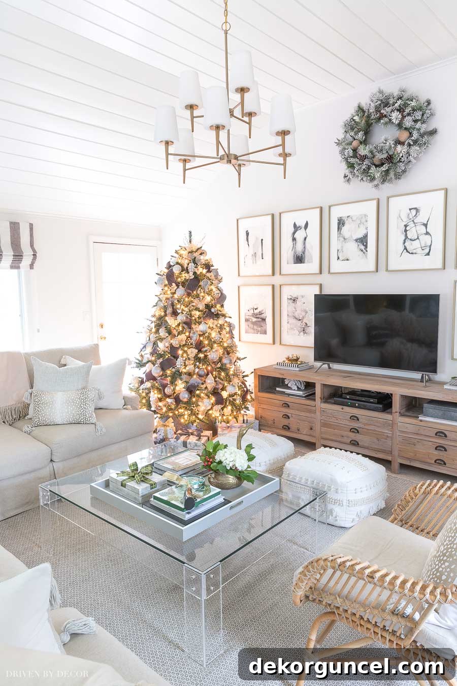 Cozy family room decorated for Christmas with a large sectional and festive accents
