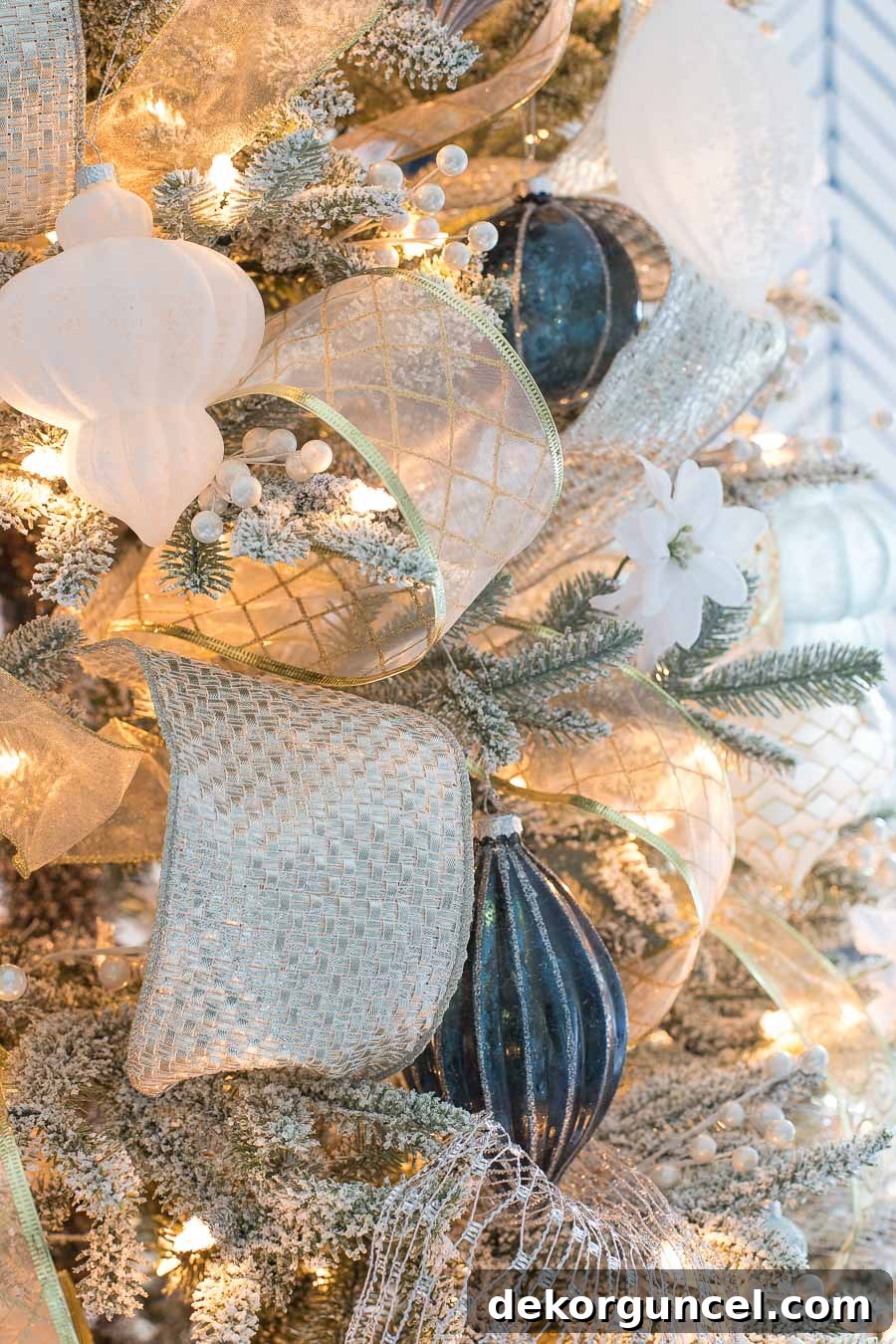 Close-up of a Christmas tree decorated with a beautiful combination of silver and gold ribbons
