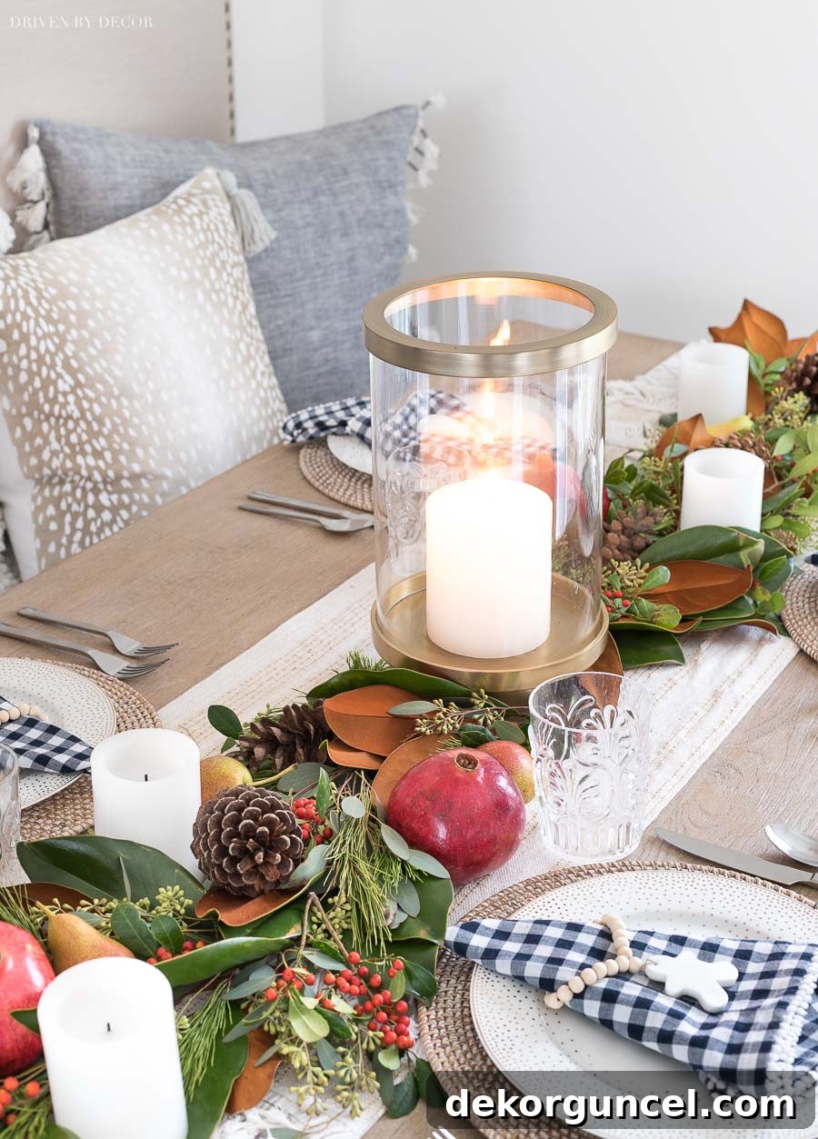 A Festive & Gorgeous Christmas Table Runner: DIY Tutorial Featuring Fresh Greenery, Vibrant Fruit, and Rustic Pinecones for Your Holiday Celebrations.