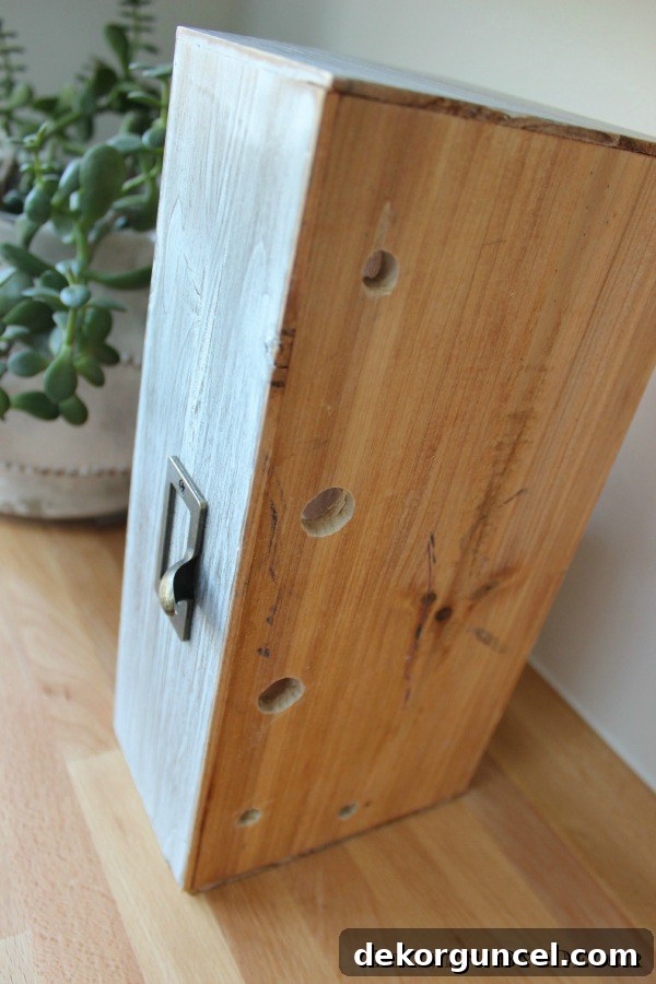 Effortless Homemade Charging Center 3 Driven by Decor - Holes drilled in bottom of family charging iPhone station