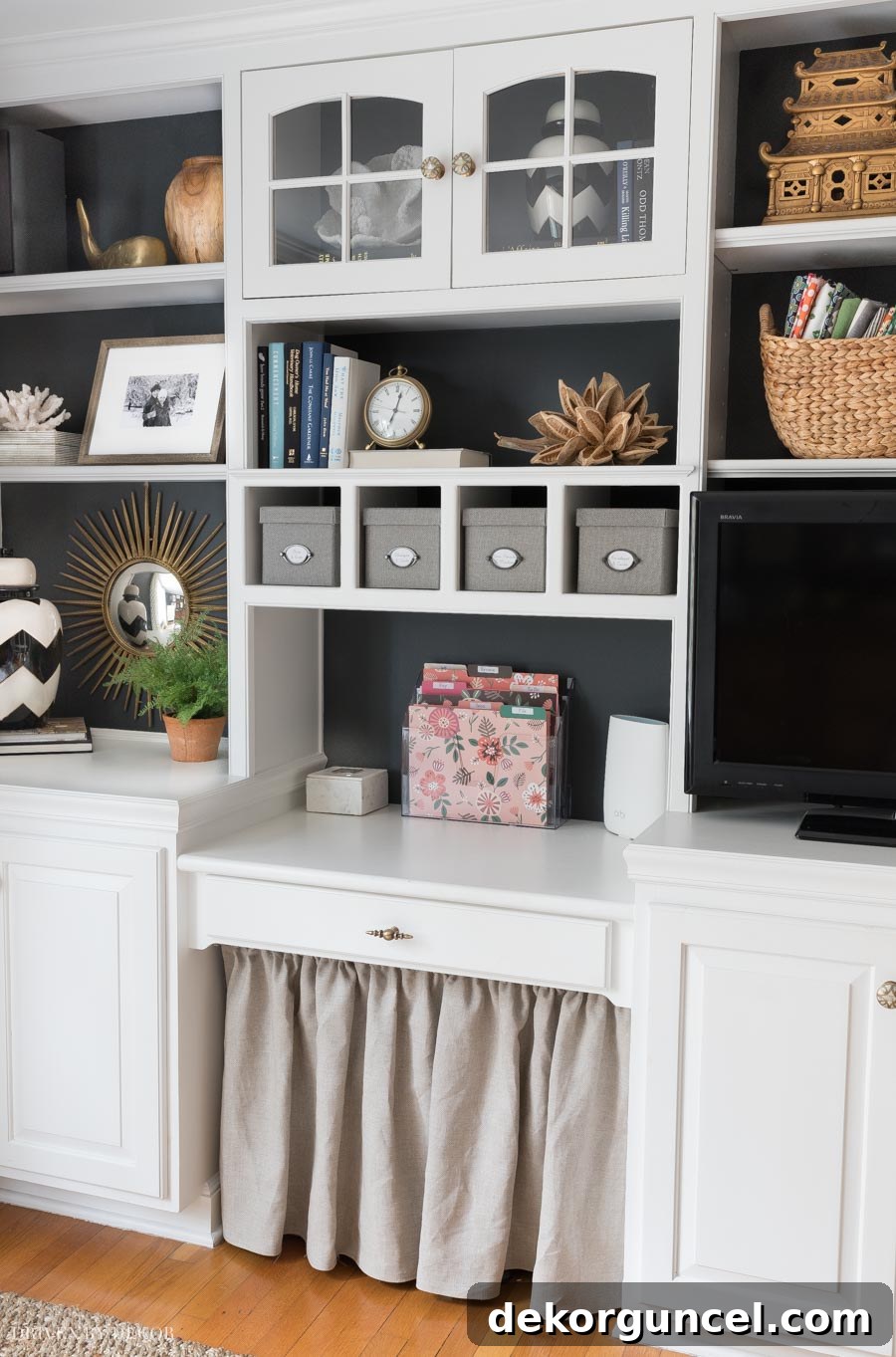 Our organized home office featuring a hidden mail station and stylish bookcase decor.