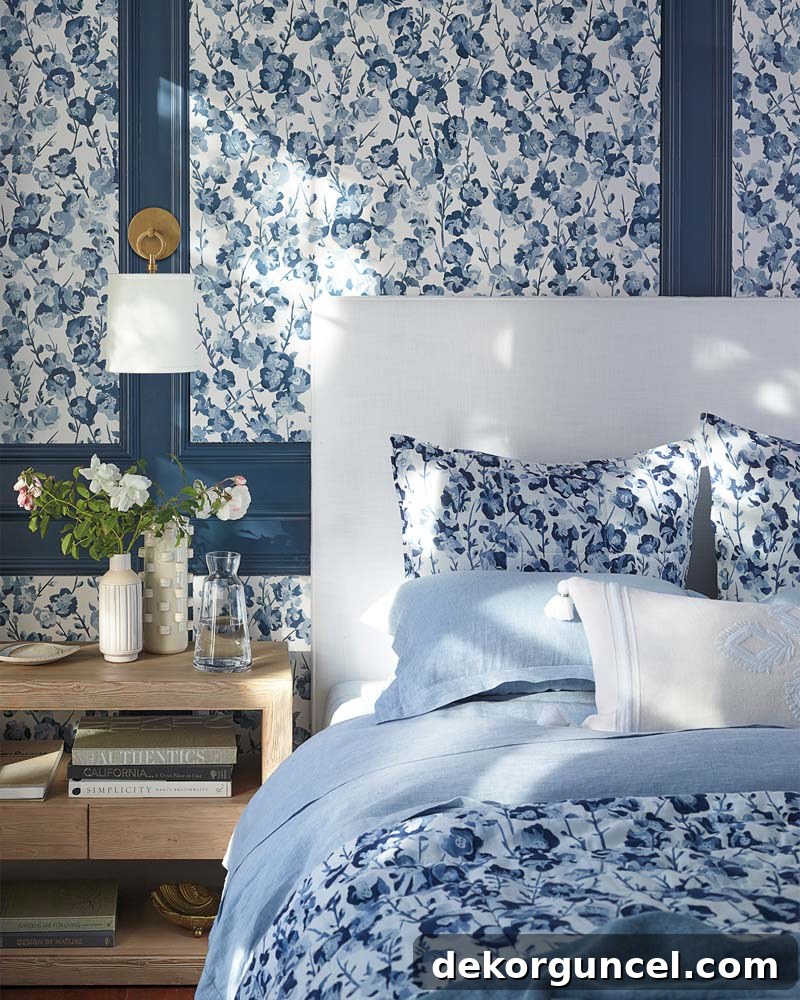 Gorgeous blue floral wallpaper combined with elegant wall molding, a stunning 2019 design trend.