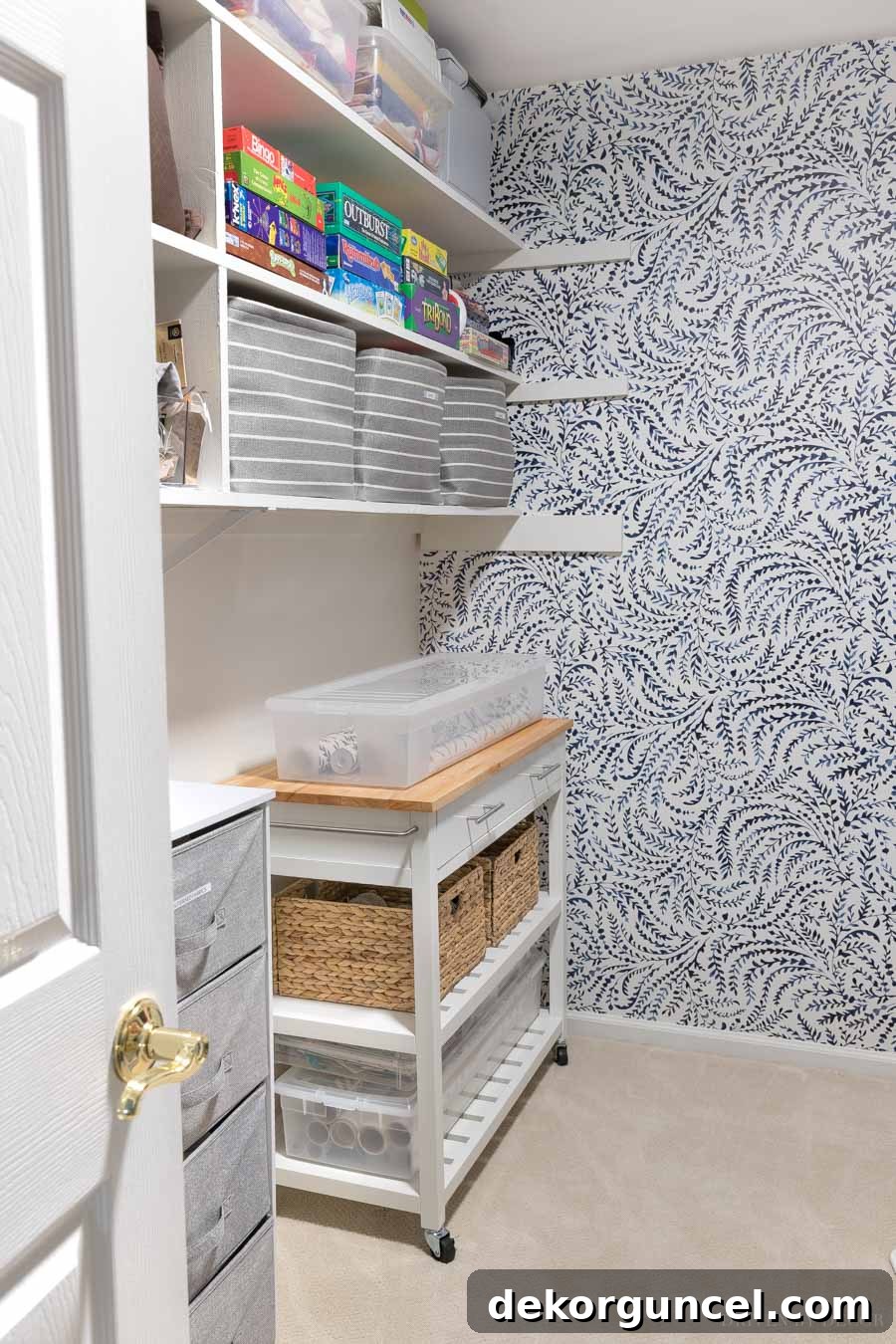 The mobile gift wrapping station is effortlessly rolled into a storage closet, highlighting its convenient portability.