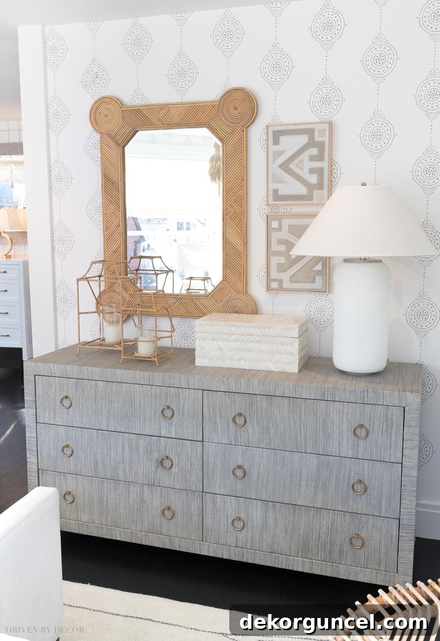 Luna Stripe wallpaper in 'Smoke' adding texture and warmth to an elegant Serena & Lily bedroom, complementing a gorgeous dresser and sophisticated decor.