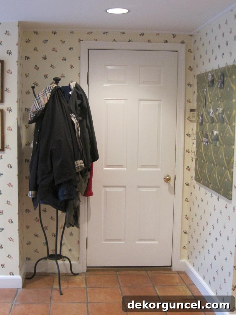 Our garage entryway "before" the transformation, showcasing a plain and uninspired space.