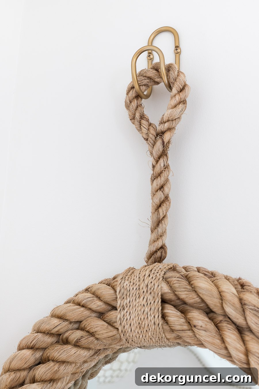A gorgeous metal loop hanger, adding a stylish and functional element to the entryway decor.