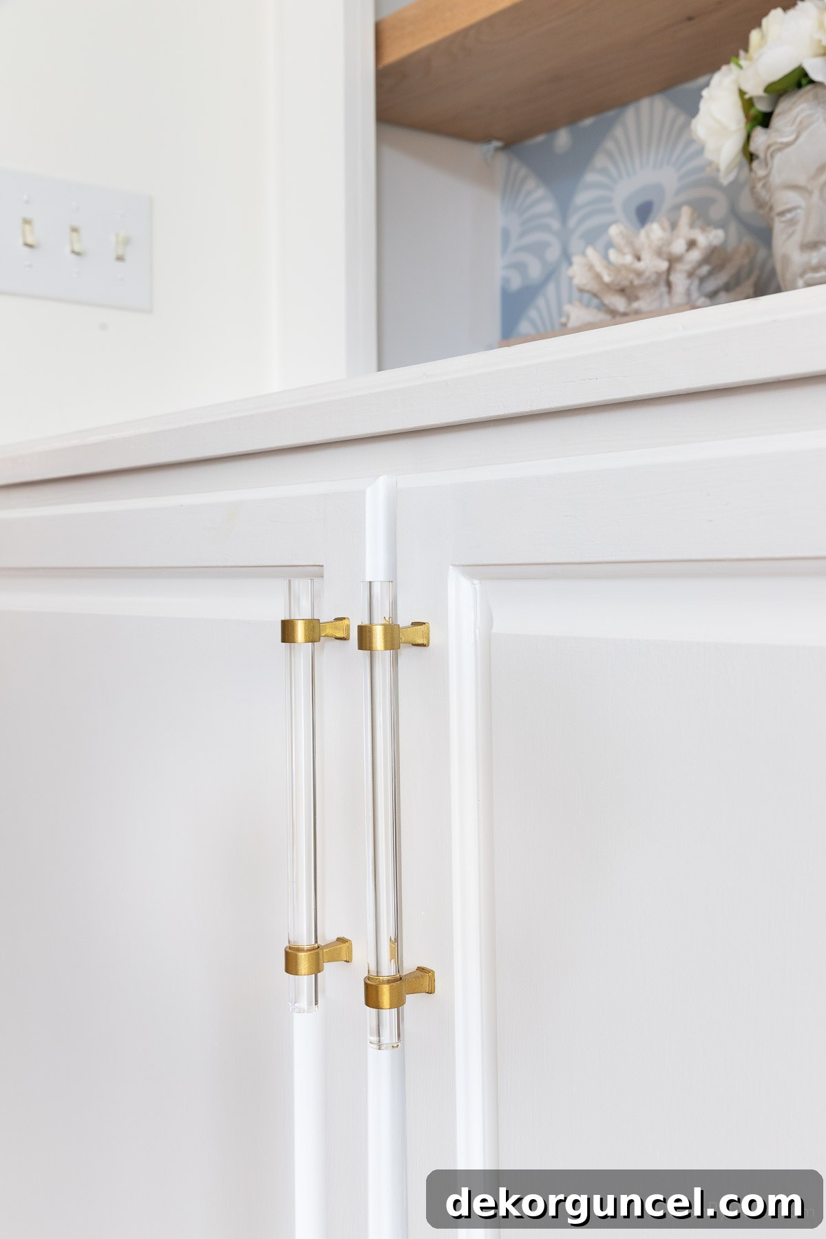 Pair of acrylic cabinet pulls on cabinet