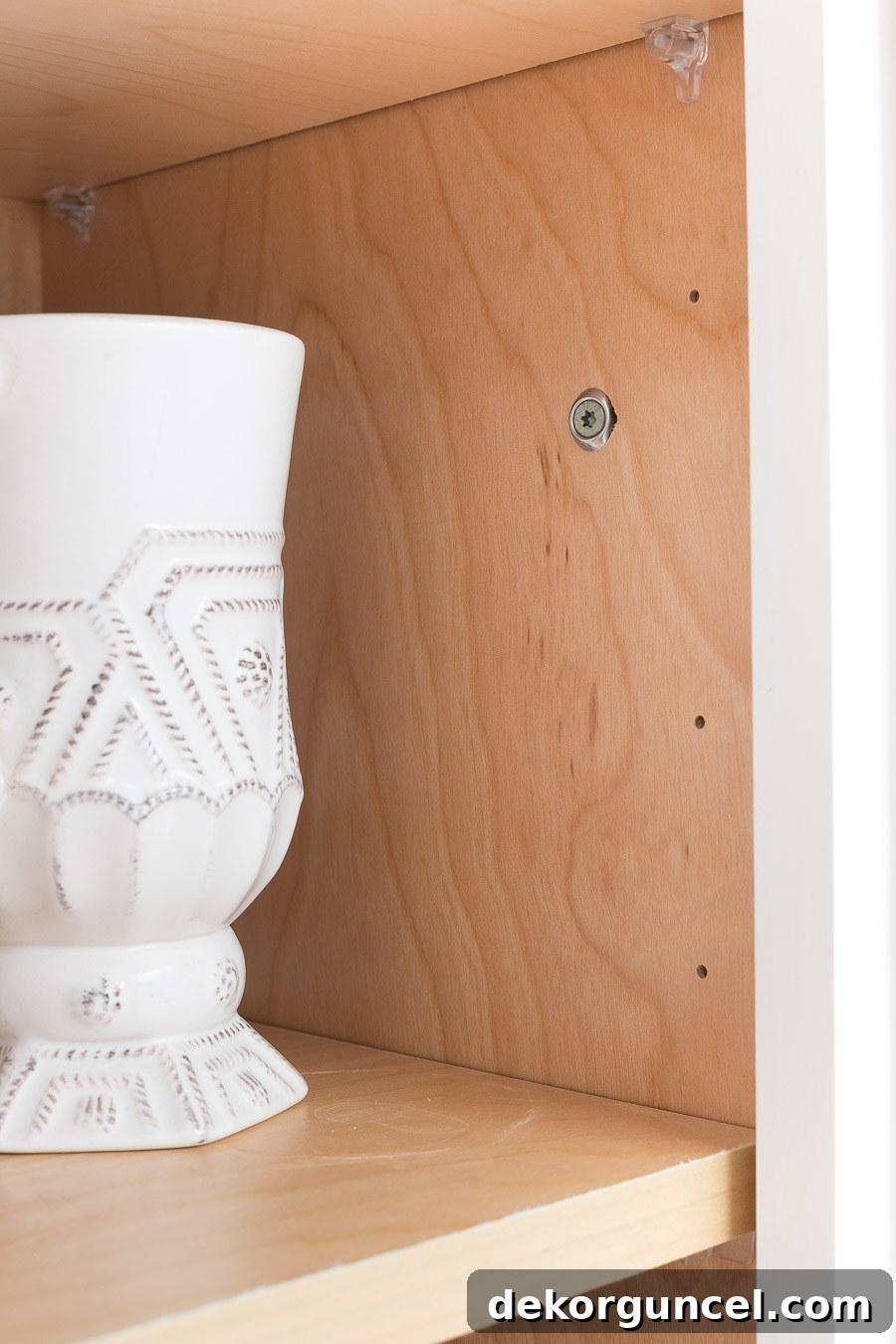 How we secured the floating corner shelves in our kitchen for ultimate stability and a perfectly level display. DIY shelf installation tips.