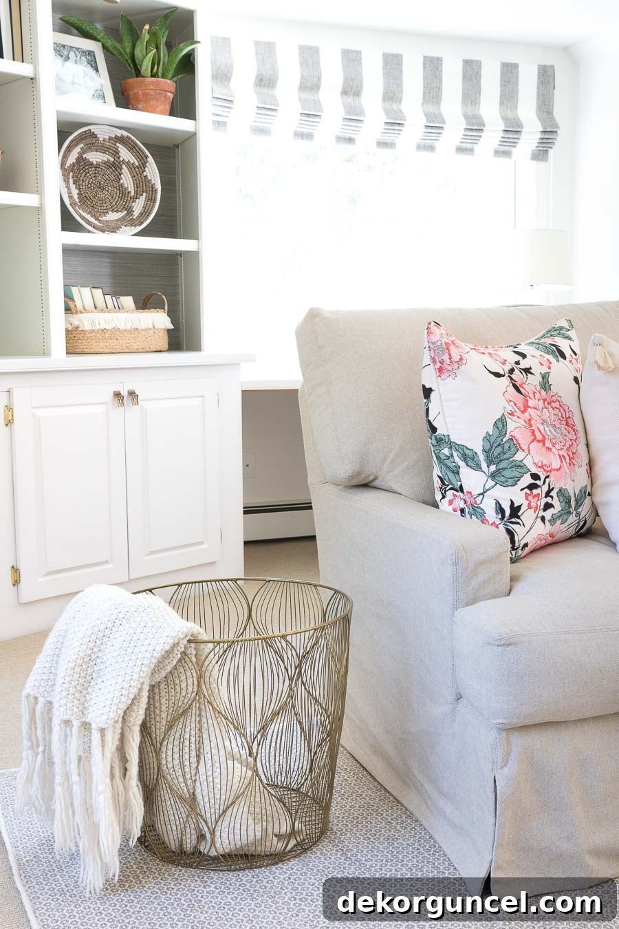 This gorgeous gold wire basket, with its unique wave design, is perfect for stylishly storing throws and decorative pillows.