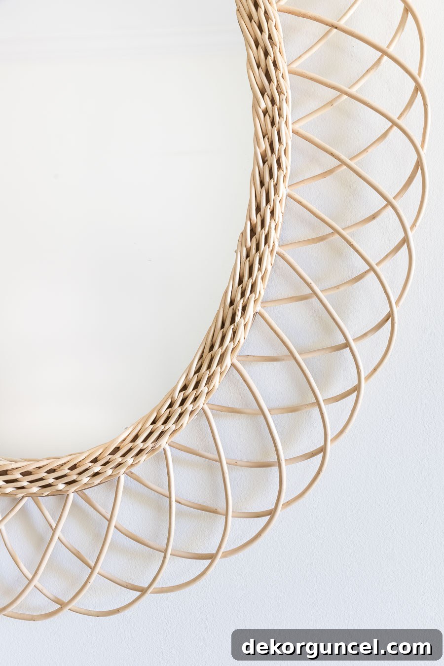 Loving this oval rattan mirror; its natural texture and exceptional price make it a standout piece for any home.