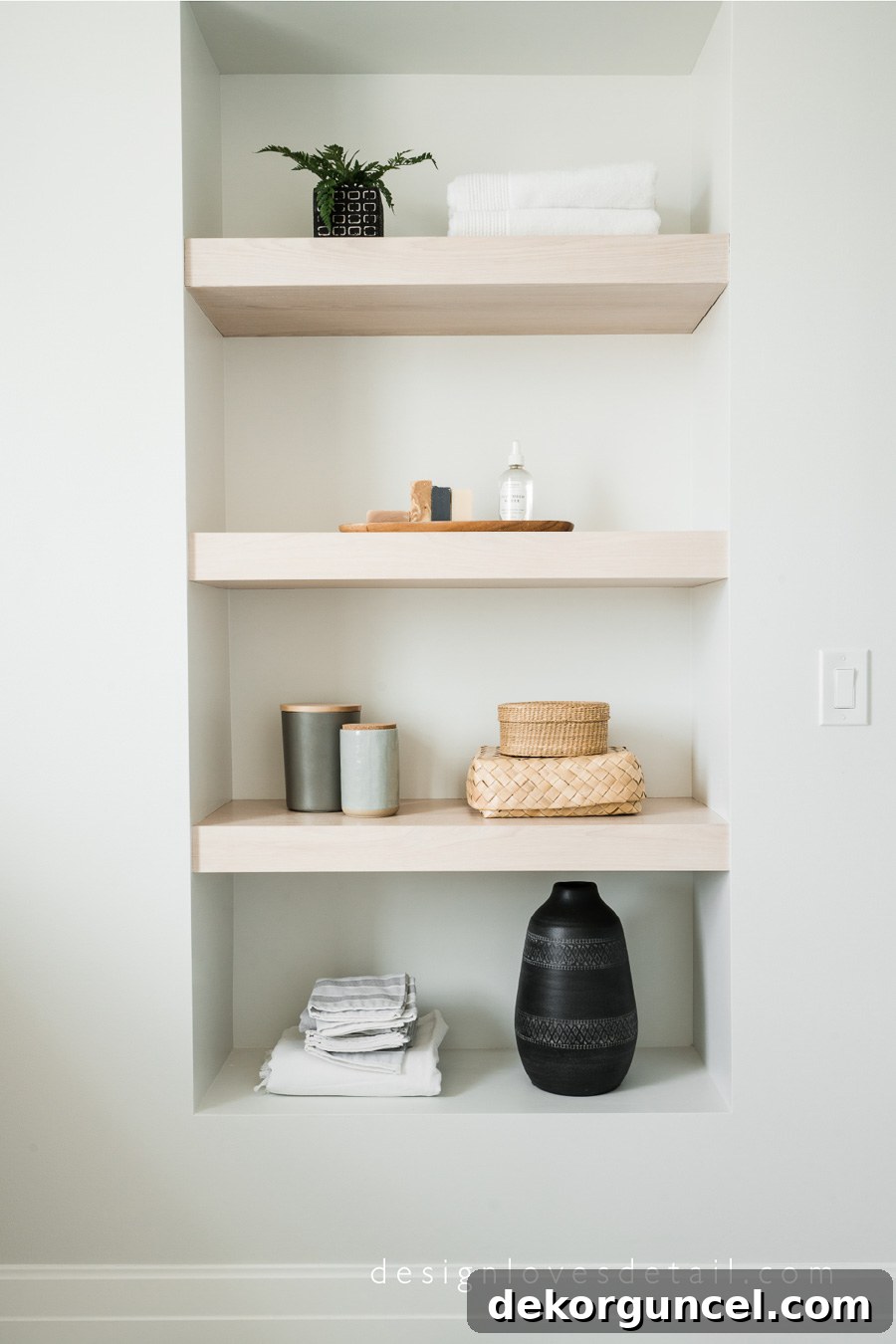 Gorgeous wood shelving in a bathroom designed by Mollie of Design Loves Detail