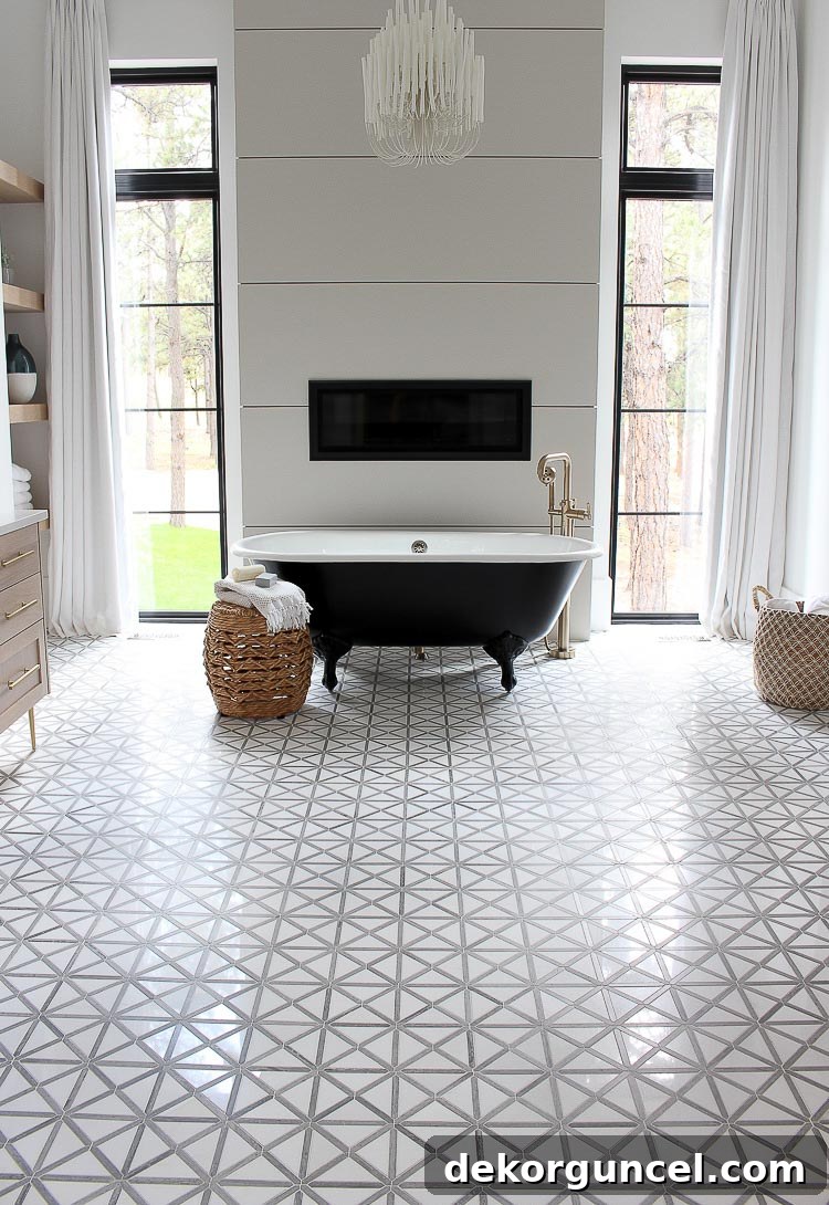 These tall windows flanking the fireplace in this master bathroom are amazing!