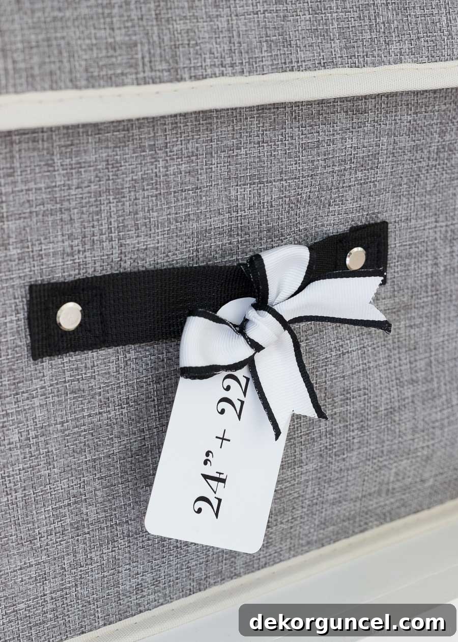 Labeled tags on fabric storage boxes, indicating different pillow cover sizes for easy identification and retrieval.