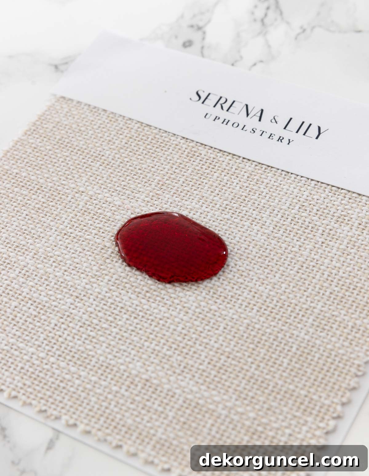 Tilly Upholstered Bed Deep Dive 9 Performance fabric showing beading of wine on top