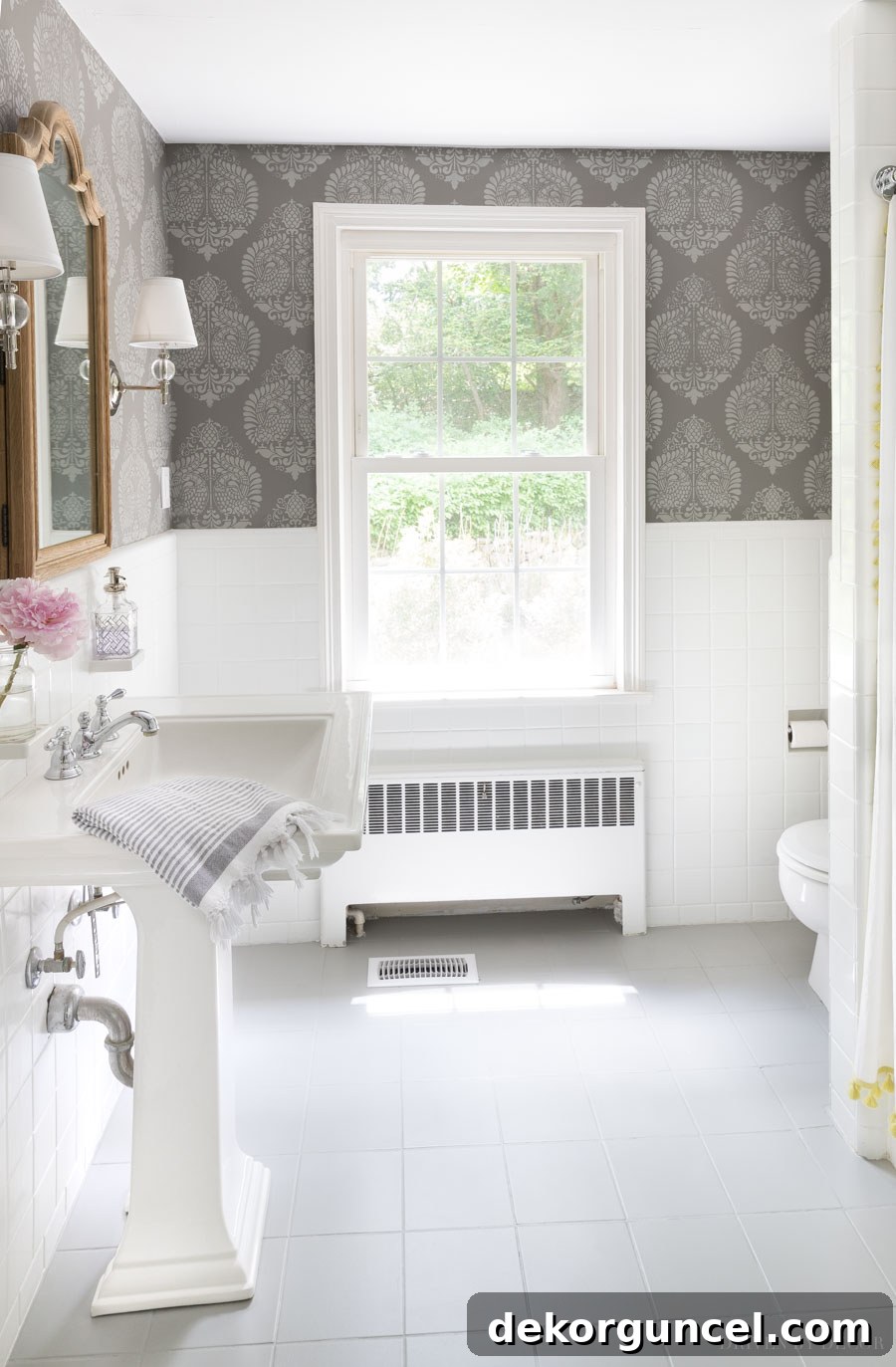 After image of a freshly painted bathroom tile floor, demonstrating a significant aesthetic improvement. The tiles now appear modern and clean.