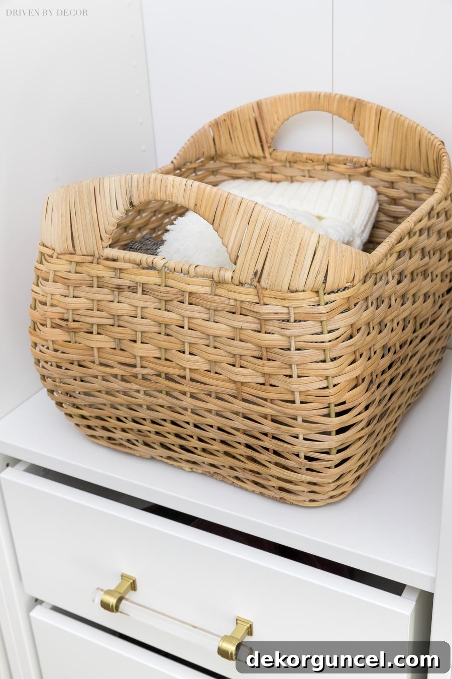 IKEA PAX Mudroom Transformation 7 Pretty woven storage baskets for hats, scarves, and gloves in our coat closet.
