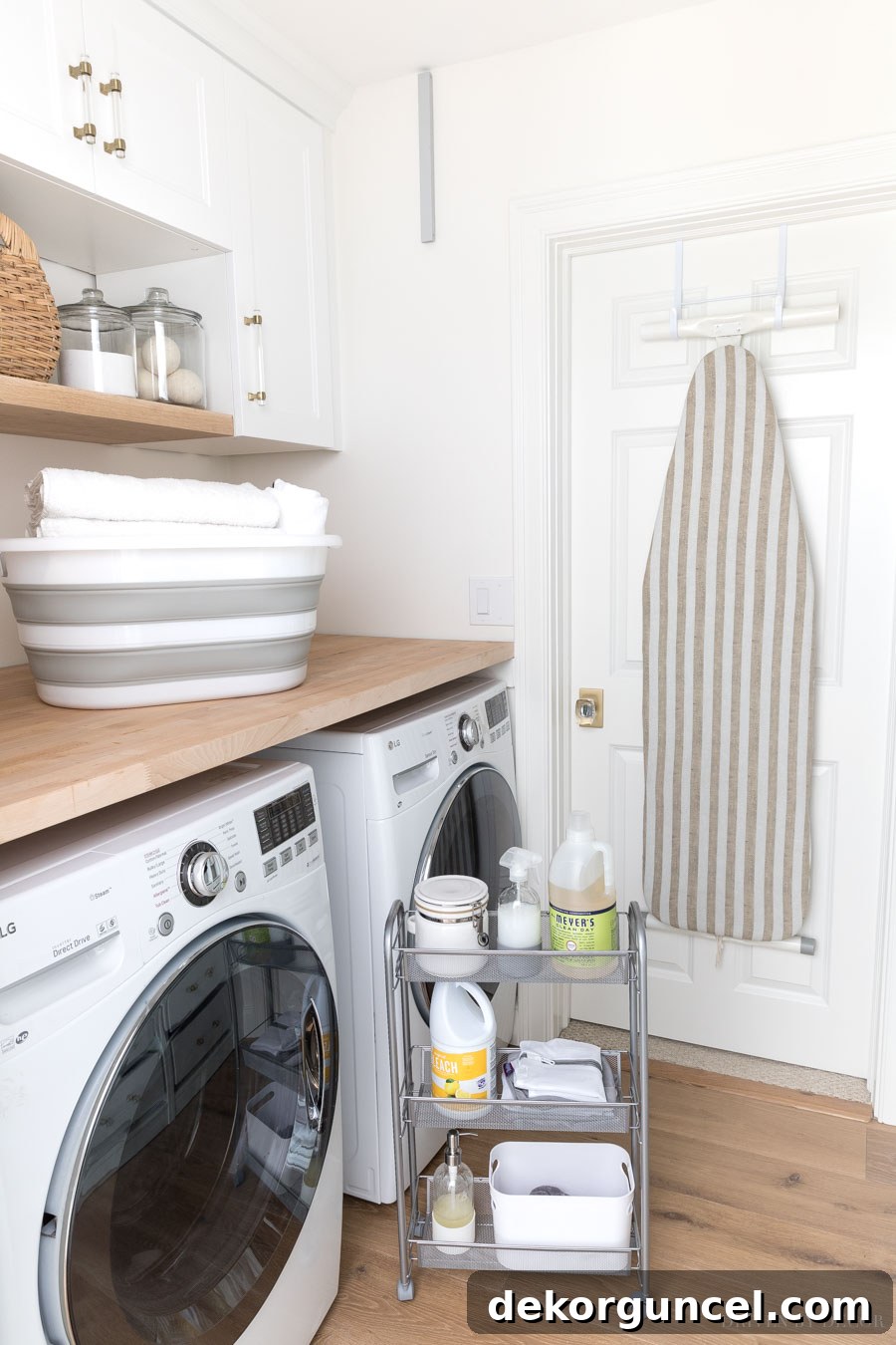 Laundry Room Storage Ideas to Maximize Your Space 2 A clever rolling cart that fits perfectly between a washer and dryer, providing essential storage in a small laundry room.