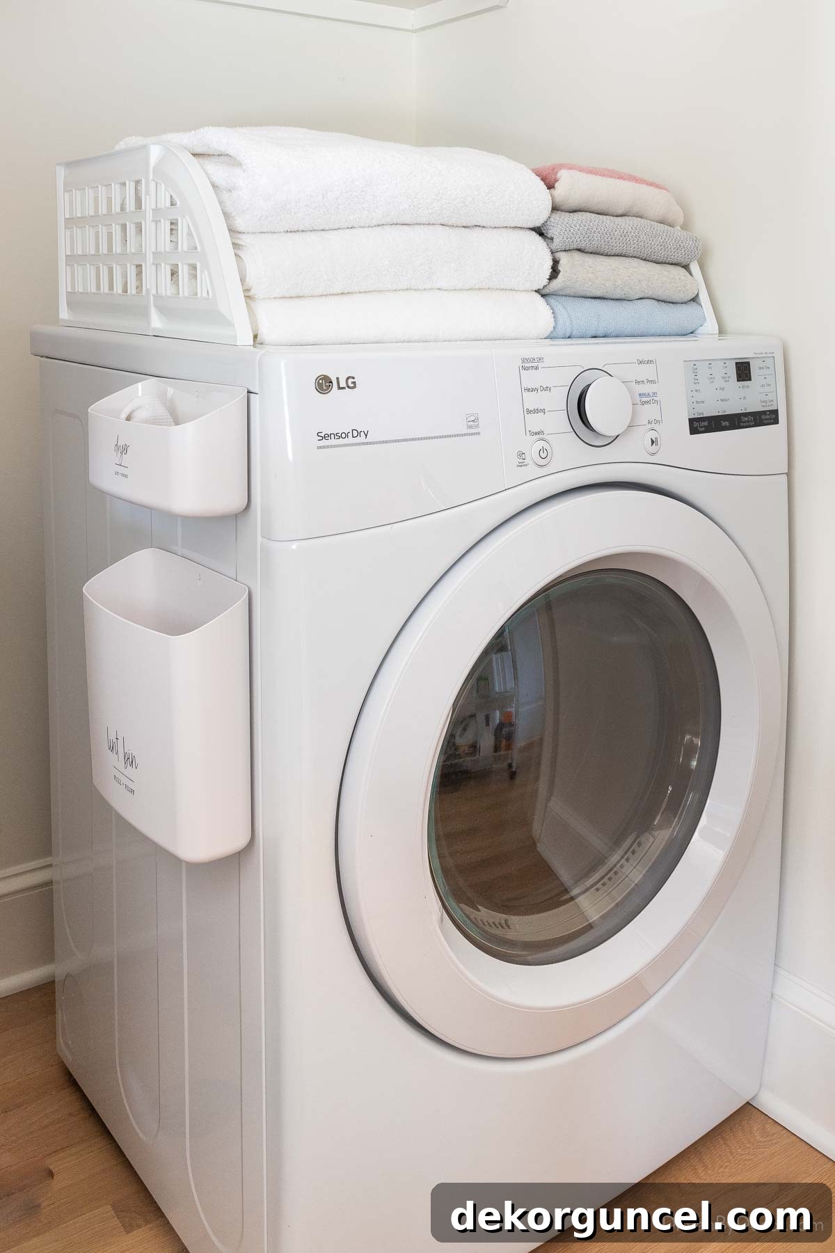 Laundry Room Storage Ideas to Maximize Your Space 15 A magnetic fence placed on top of a dryer, effectively corralling laundry and preventing items from falling.