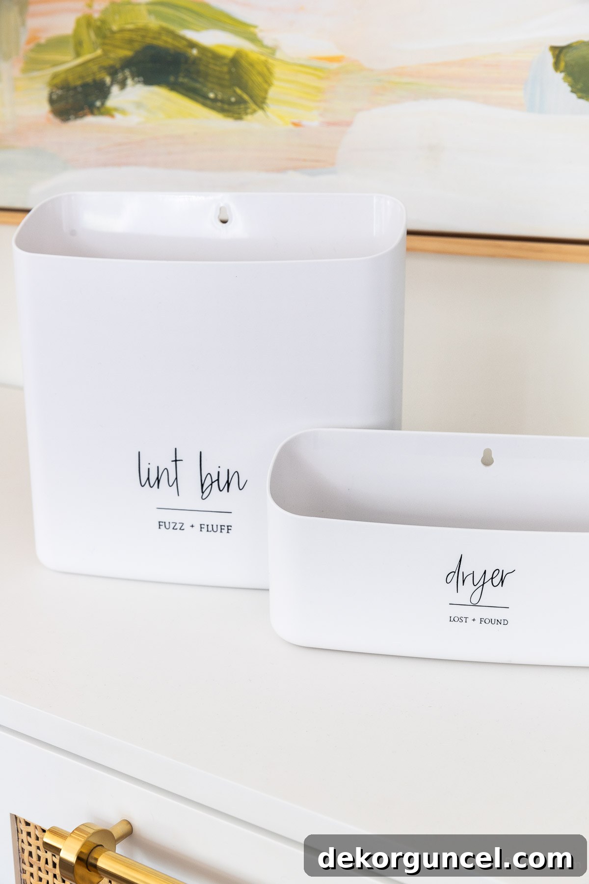 Laundry Room Storage Ideas to Maximize Your Space 5 A set of two magnetic laundry room bins, perfect for keeping small items organized on the side of a washer or dryer.
