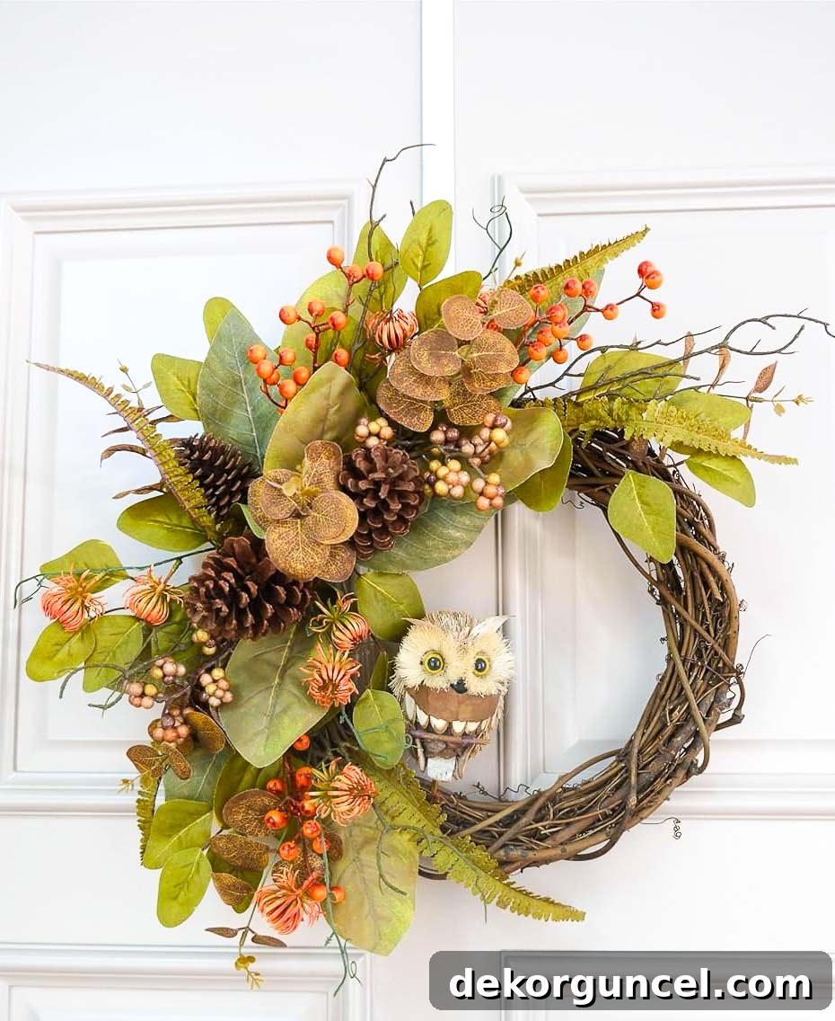 A 24-inch woodsy owl wreath on a grapevine base, offering a charming and versatile option for fall decor.